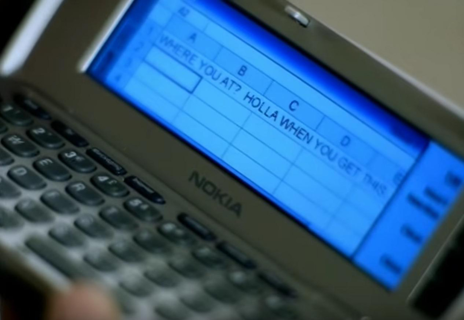 A frame from a music video that uses a spreadsheet on a phone to look like sending a text message.